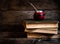 Old books, glasses, calabash, bombilla against the background of old wooden boards, conditions for a deep and pleasant reading.