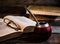 Old books, glasses, calabash, bombilla against the background of old wooden boards, conditions for a deep and pleasant reading.