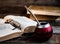 Old books, glasses, calabash, bombilla against the background of old wooden boards, conditions for a deep and pleasant reading.