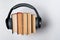 Old books and headphones on a white background. Audiobooks audio library concept. Top view