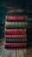 Old books stack with red and green hues, vintage charm