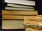 Old books stacked in a pile. Education, knowledge, reading habits, paper, library.