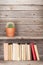 Old books on a wooden shelf