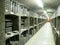 Old bottles of wine in rows in wine cellar. Rows of many wine bottles in winery cellar storage. Beautiful texture or