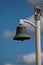 Old brass ship bell on mast