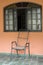 Old Brazilian rustic chair and window