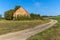 Old brick barn in the Czech countryside. Agricultural landscape. Hot summer day on the farm