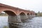 Old Brick bridge across the River Venta in the city of Kuldiga Latvia