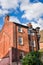 Old Brick Building under Blue Sky with Clouds