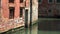 Old Brick Building Wall with Damaged Plaster in Calm Streets of Venice Italy