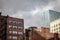 Old brick buildings, American architecure, and modern business glass skyscrapers standing in downtown Montreal