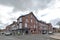 Old brick buildings at street corner on Monkgate and St Maurice Road in historic district of City of York, England, UK