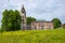 An old brick dilapidated Church on a green hill