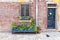 Old brick facade decorated with flowers