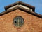 Old brick factory building with broken window