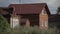 Old brick and new wooden house.