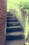 Old brick staircase lined front of residential home