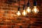 Old brick wall and four old lamps close-up, background