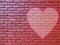 Old brick wall graffiti heart, valentines day background