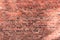 Old brick wall of red color, damaged masonry as abstract background composition