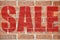 Old brick wall texture with SALE inscription