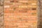 Old brick wall texture with wooden uprights