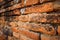 Old brick wall in Wat Thammikarat Ayutthaya, Thailand