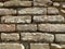 Old brickwork. Wall of an old residential building. Brick wall made of bright red bricks. Lightly worn surface. Neat masonry,