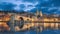 Old bridge and city skyline at dusk in Avignon, France