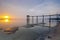 Old bridge at jeram beach during sunset