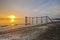 Old bridge at jeram beach during sunset