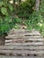 an old bridge made of weathered bamboo