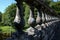 Old Bridge Parapet Over a River Closeup View