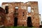 An old broken brick wall with cracks. Ruined wall of the old cathedral