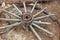 Old broken carriage  wheel on the ground in New Zealand