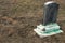 Old broken gravestone covered with moss at historic cemetery