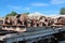 Old broken wheels of a metal trolley in a junkyard wagons