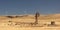 Old broken wind pump and new wind generators. Australia.