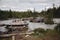 Old, broken, wooden bridge over the river in the Altai mountains. Extreme crossing the river