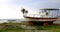 Old and broken wooden metal boat stranding on sea beach on island of Cyprus. 4k video 4096X2160