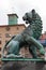 Old bronze lion statue mounted in Bergen port
