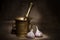 Old bronze mortar and pestle with garliÑ on canvas background