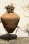 Old brown amphora in mediterranean style.
