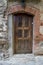 Old brown door of a morbid house