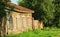 Old brown-gray abandoned wooden country house