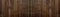 Old brown rustic dark woodenboards wall texture - wood background panorama banner long textured pattern