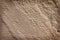 Old brown sandstone background in seamless rough shaped patterns texture