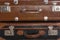 Old brown suitcases close up