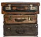 Old brown suitcases on white background