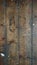 Old brown wood floorboards, vertical alignment, portrait, paint rings